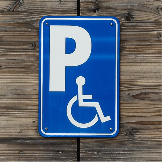 Parking sign with wheelchair symbol