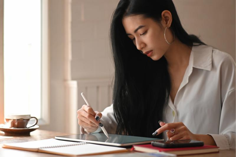 [A woman viewing her ipad]