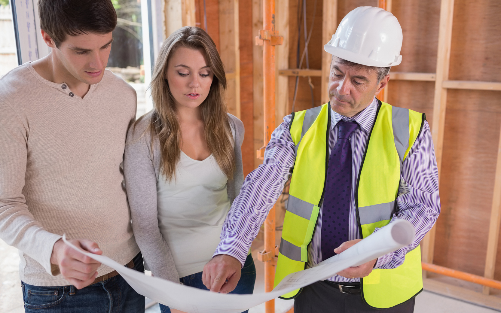 [A Picture of a woman discussing home repairs with her contractor] 