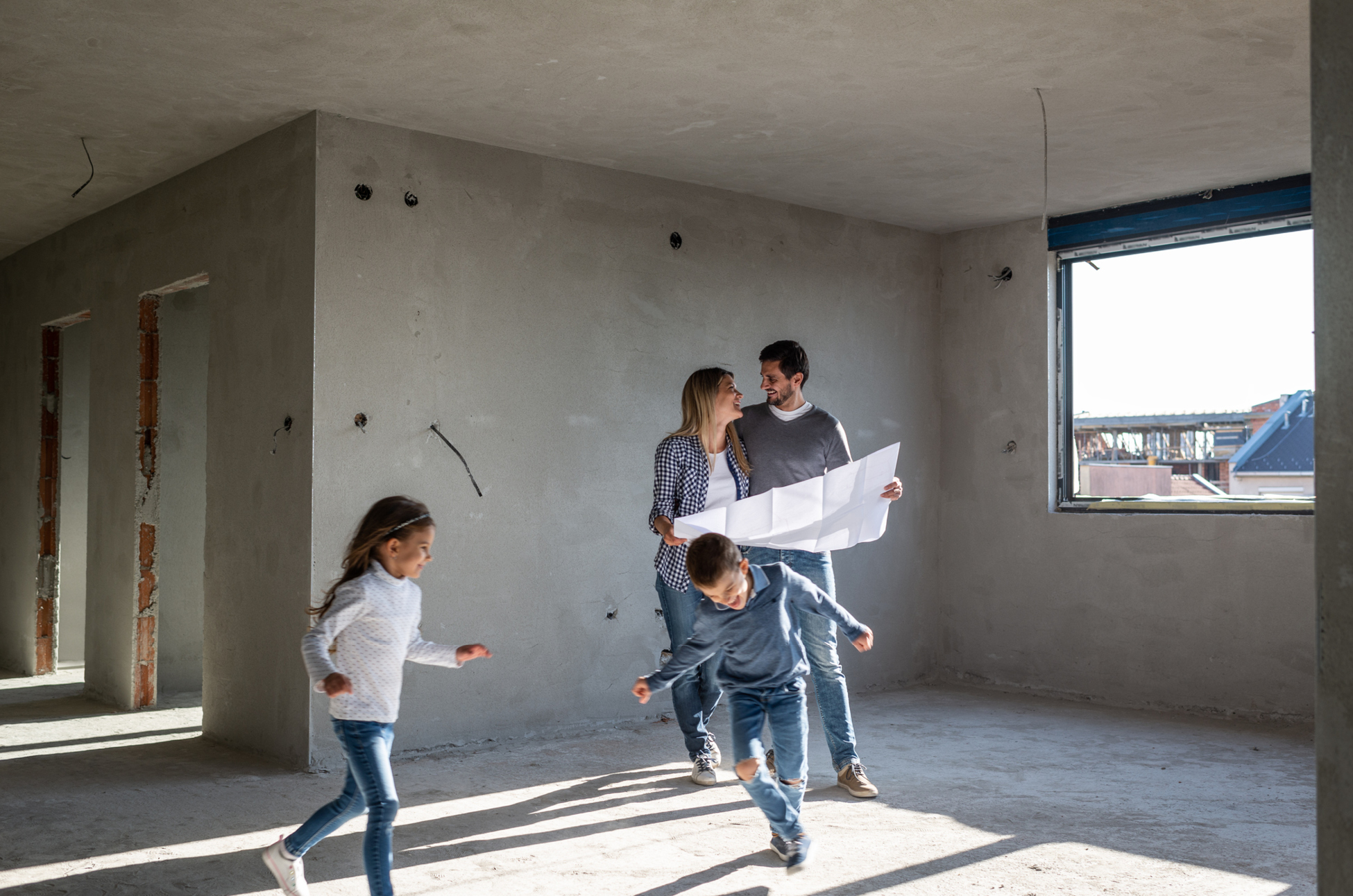 [A Family in a room under construction]