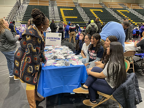 [HUD RA Alicka Ampry-Samuel chats with young volunteers from Essex County College]